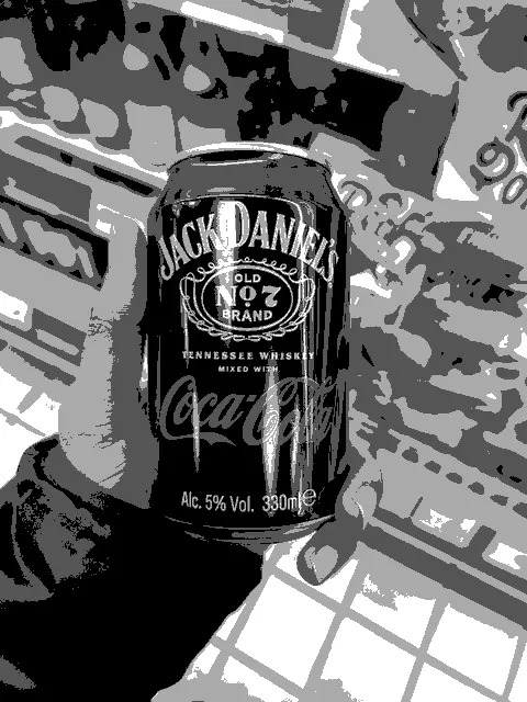 A guy holding a can of Jack Daniels Cola in grayscale