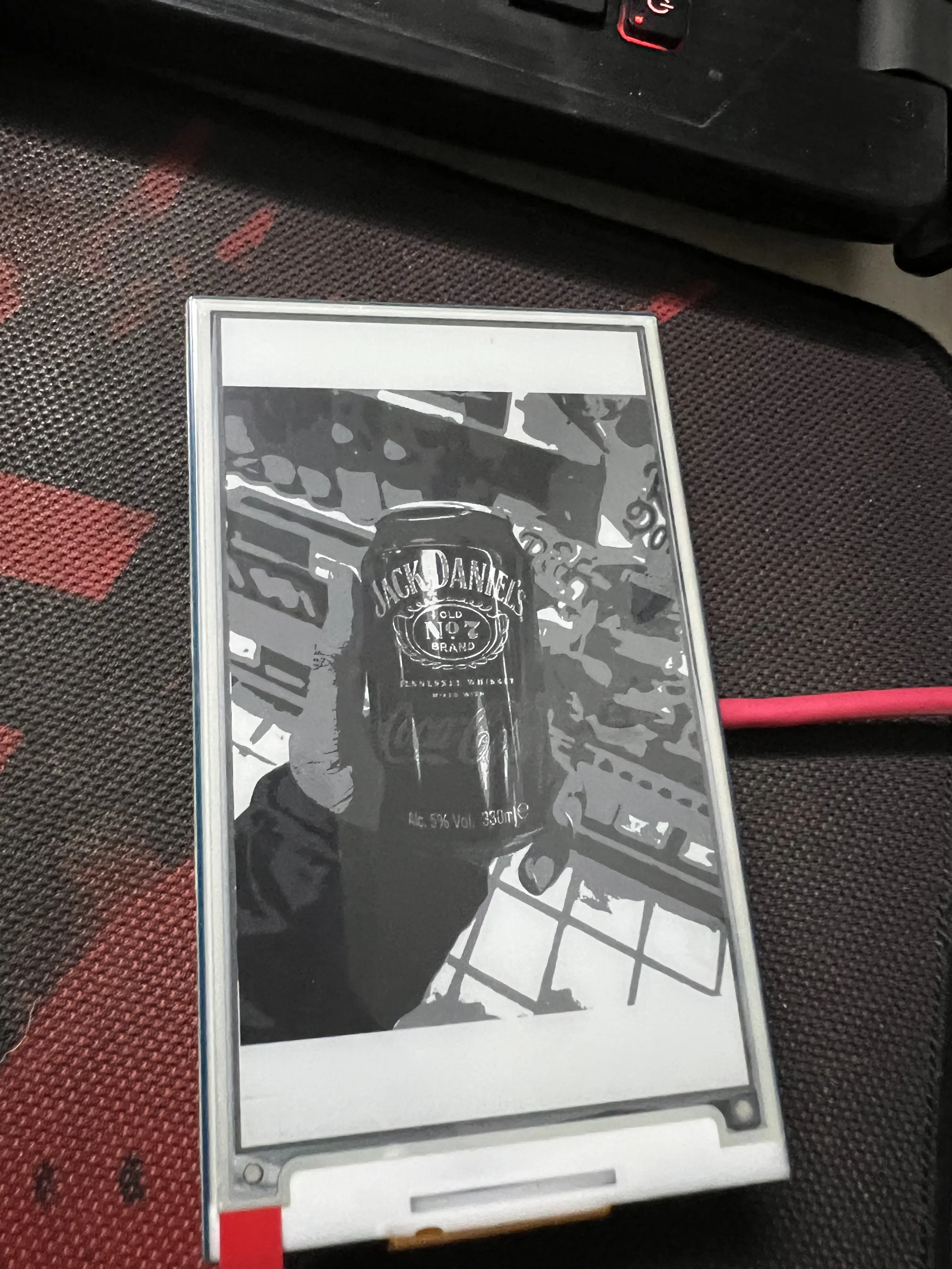 Photo of an eink display, showing a photo generated previously